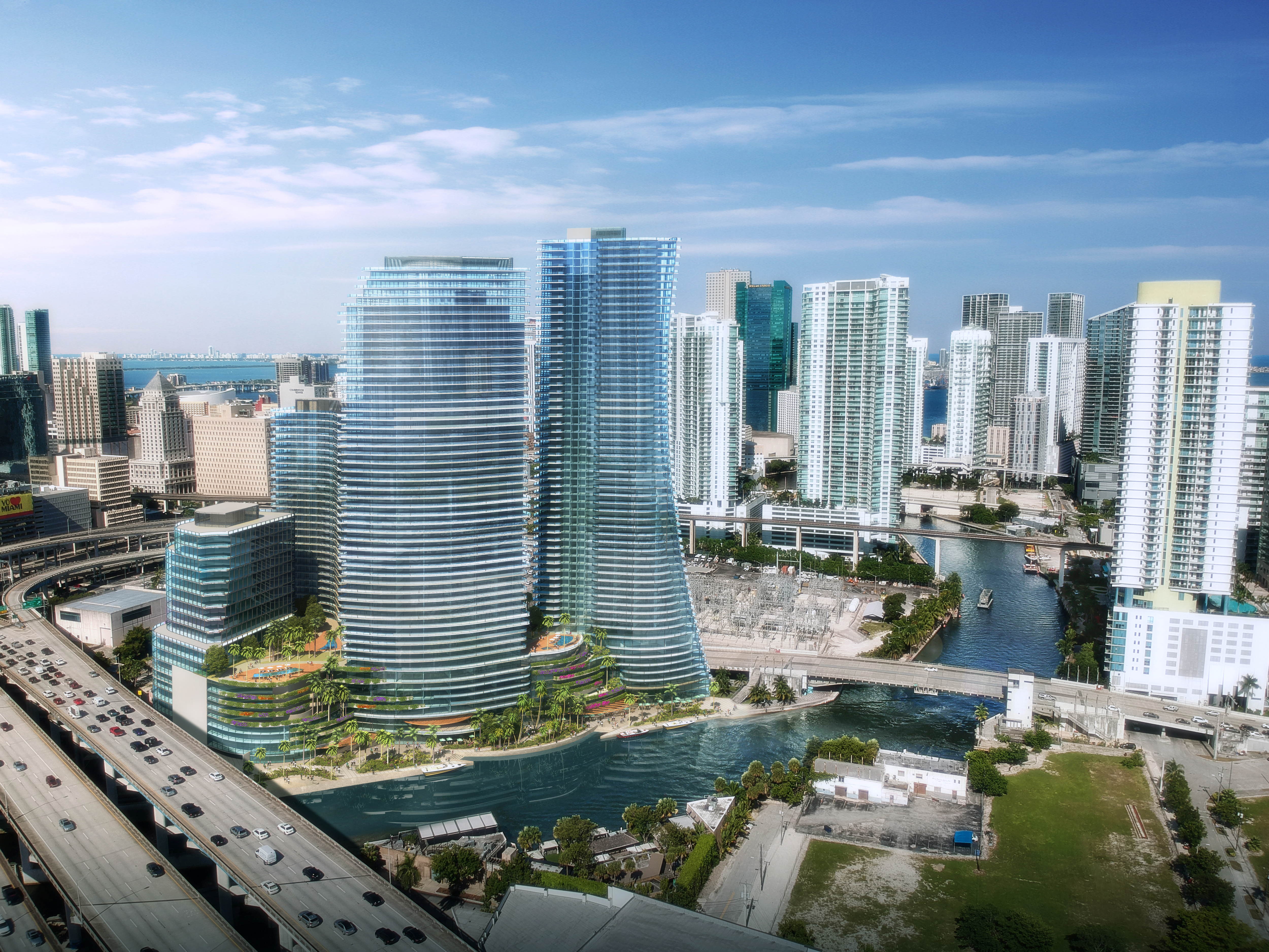 Modern Miami River apartment building at daytime with city in the background.