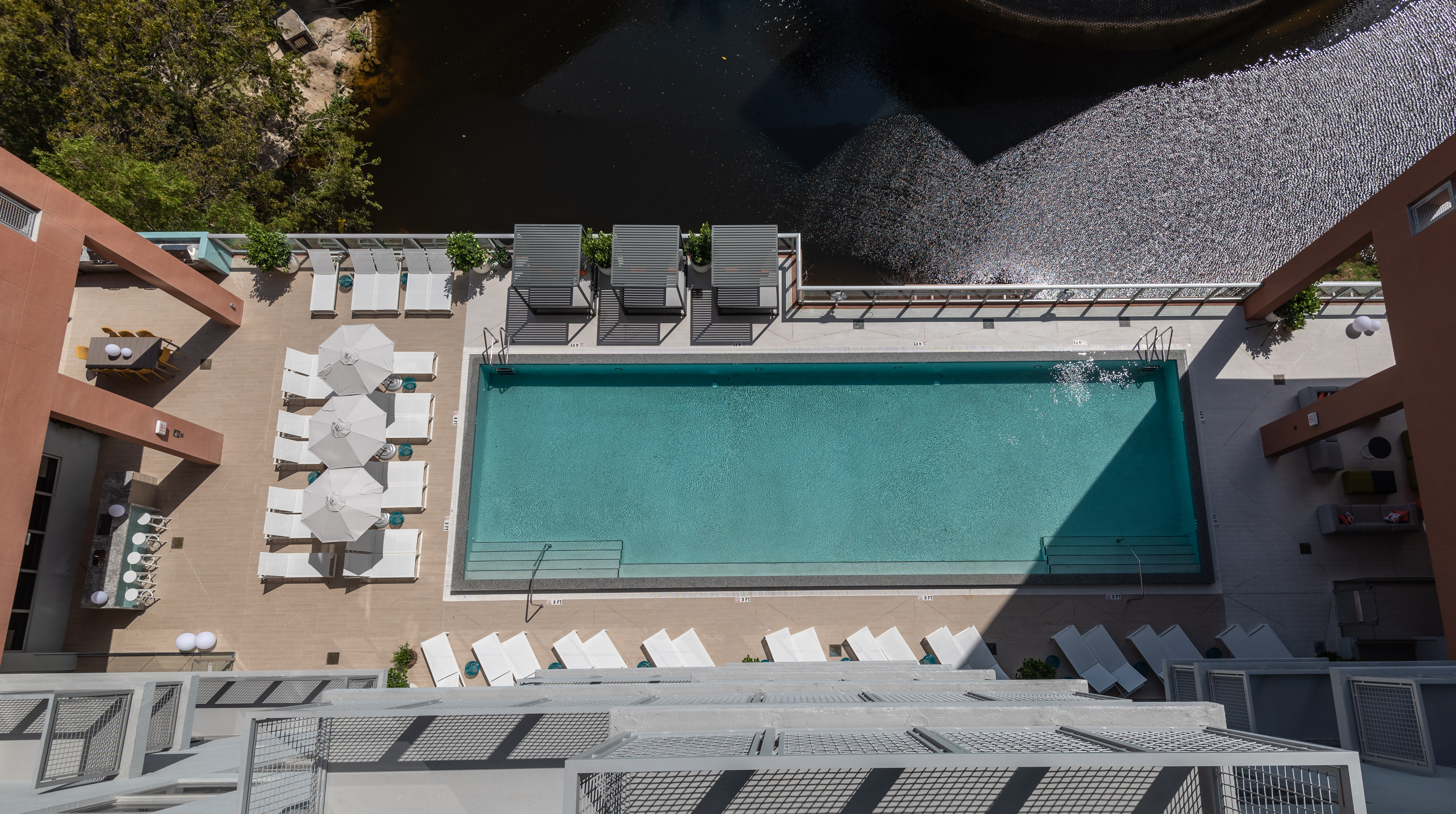 aerial view of high rise building with pool