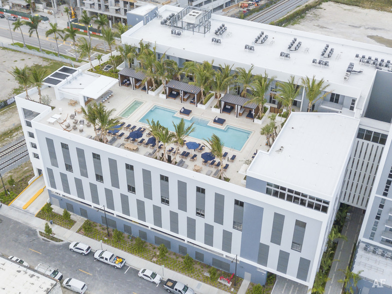 Midtown Miami aerial view of midrise apartment building with rooftop pool.